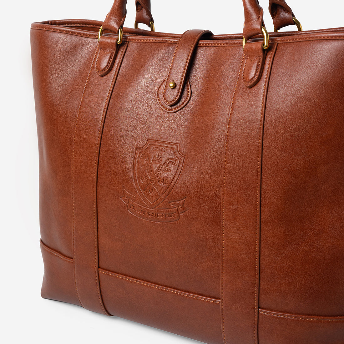 Debossed crest on the vegan leather tote